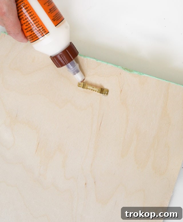 Craft Your Own Clip Memo Board 9 Attaching Bulldog Clips with Industrial Adhesive to the Front of the Board