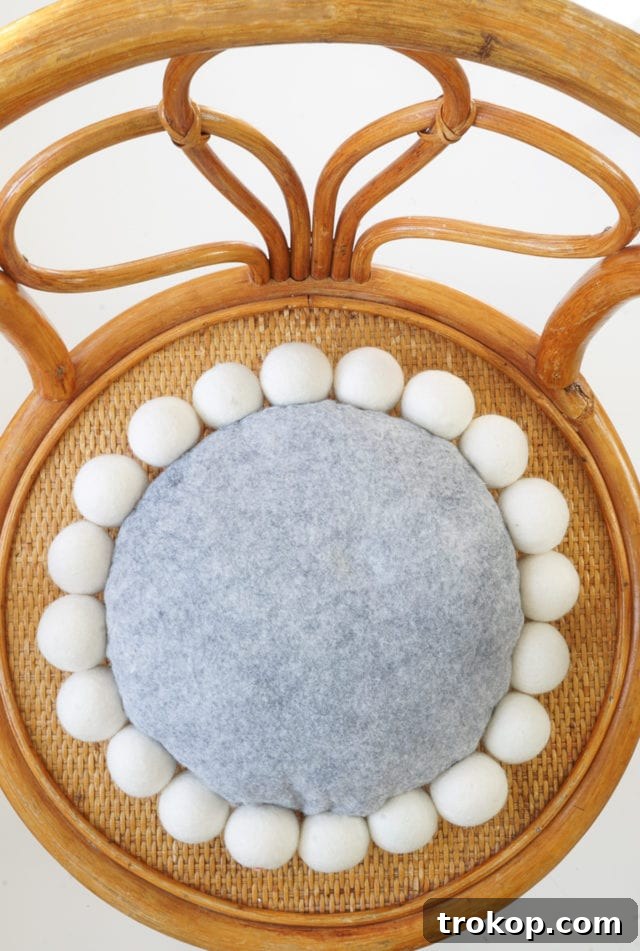 DIY Snowball Pillow - Styled in a Modern Living Room
