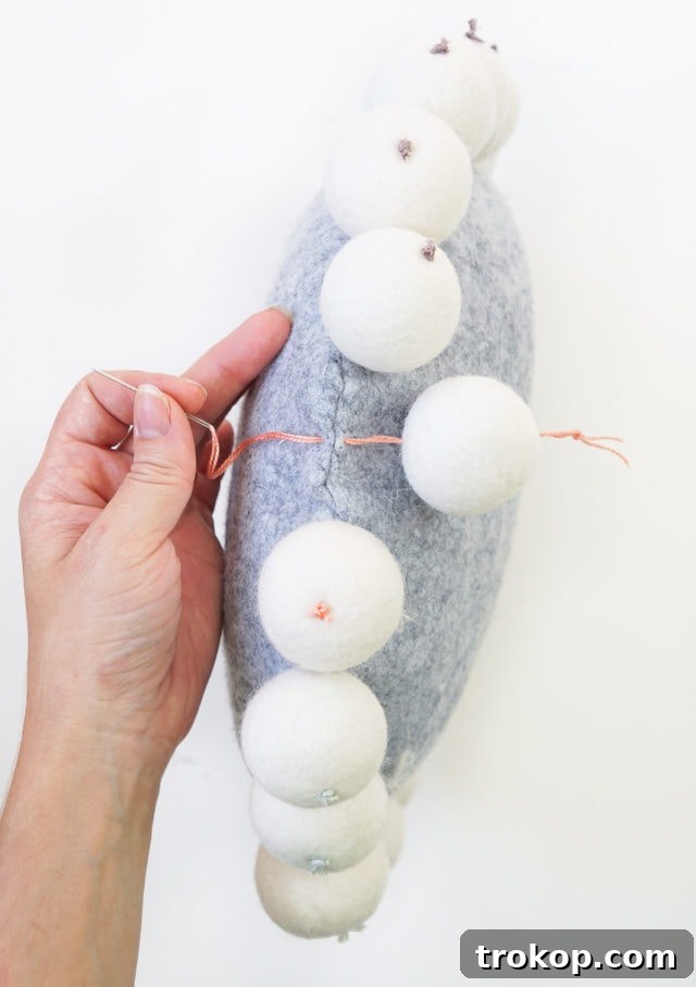 Fluffy Snowball Pillow Creation 8 DIY Snowball Pillow - Threading Wool Beads