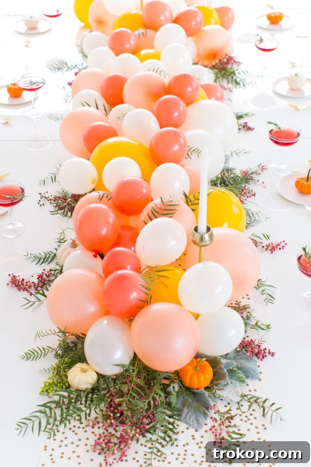 Latex balloon centerpiece arranged on a long Friendsgiving table