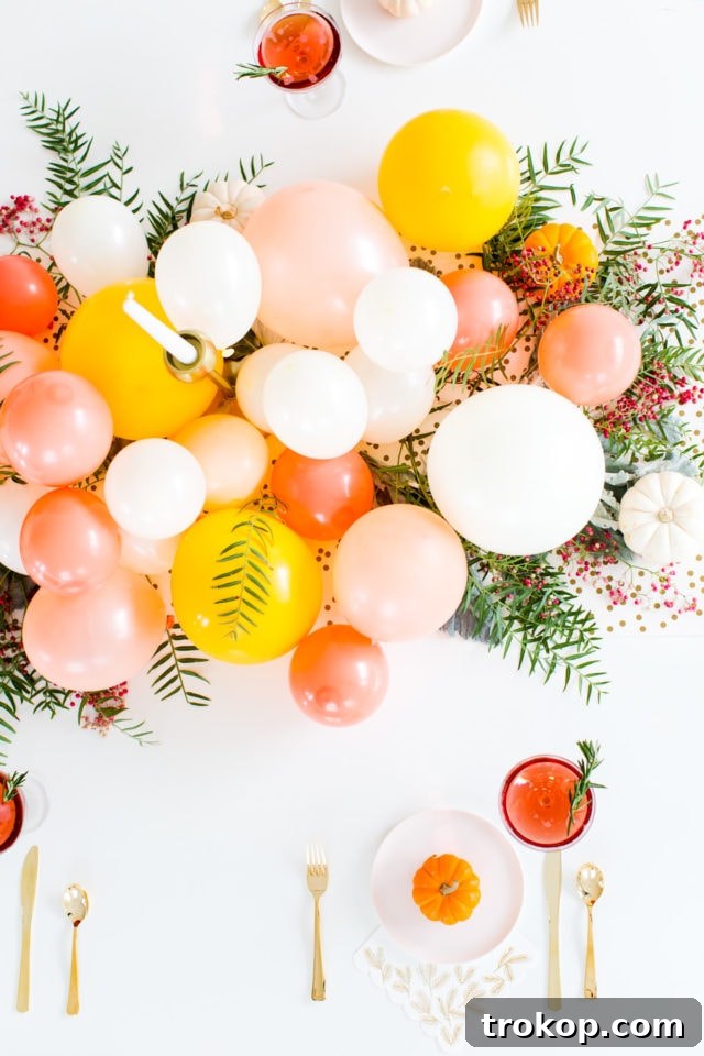 Overhead view of a beautiful, clustered balloon centerpiece for Friendsgiving