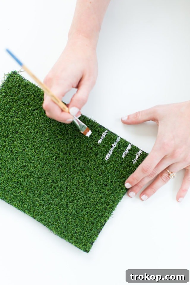 Kick Off Your Table with DIY Football Coasters and Mats 11 Painting white lines on artificial turf placemats for a football field look