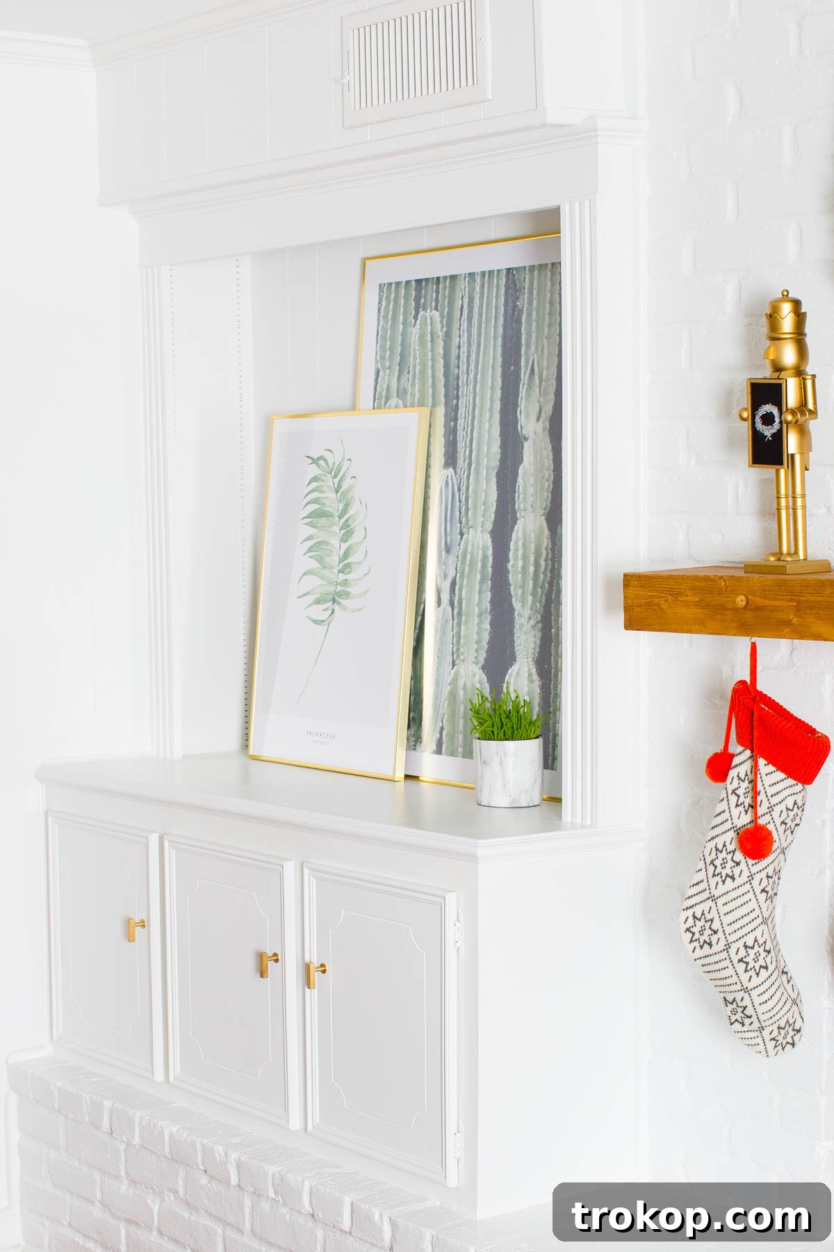 After: The living room showcasing versatile artwork, including a large cactus print, designed for year-round appeal.