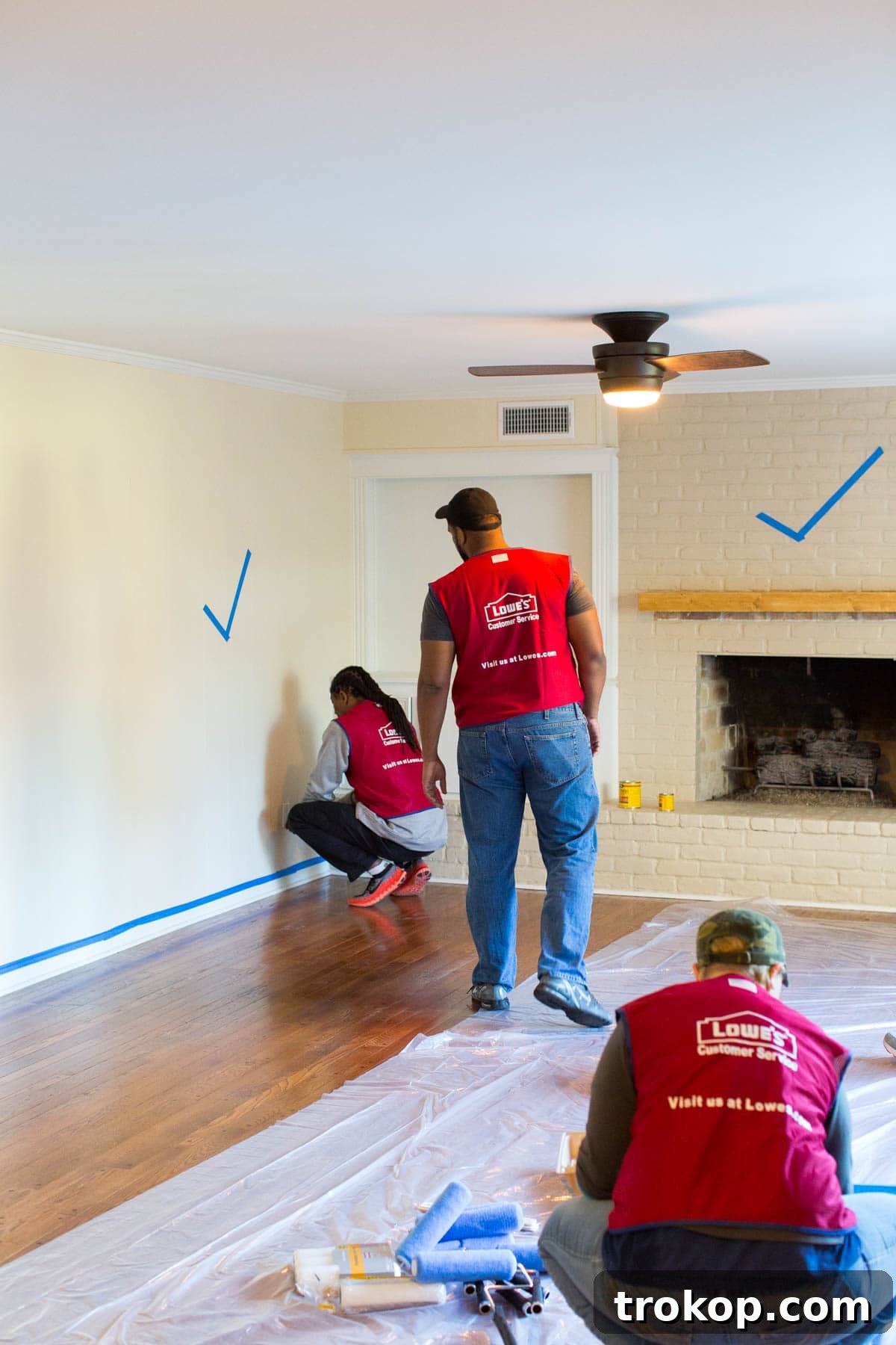 Unwrapping Our Holiday Living Room Makeover, Courtesy of Lowe's 5 After: The newly renovated living room, featuring the distressed wood mantle and festive holiday decor.