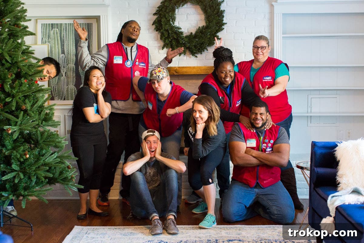 Unwrapping Our Holiday Living Room Makeover, Courtesy of Lowe's 6 Renovation Day: Volunteers from Lowe's and Sugar & Cloth team working together on the living room makeover.