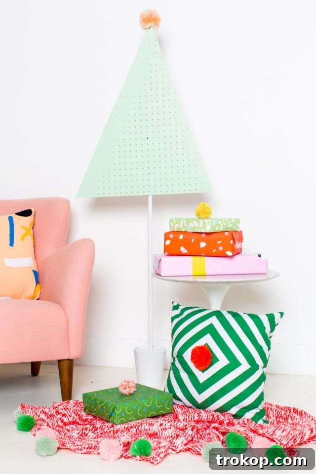 Craft a Modern Pegboard Christmas Tree 7 The newly painted mint green pegboard Christmas tree standing tall, awaiting its festive decorations.