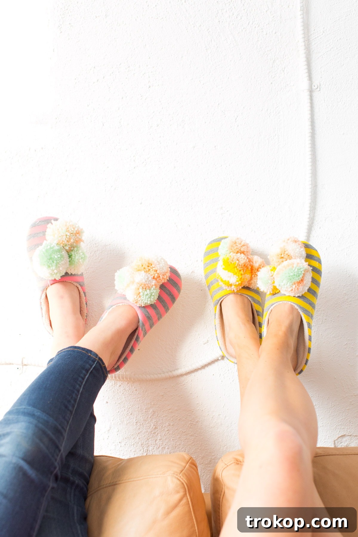 Discover how to make your own cozy DIY pom pom slippers, a fun winter craft project by lifestyle and DIY blogger Ashley Rose of Sugar & Cloth