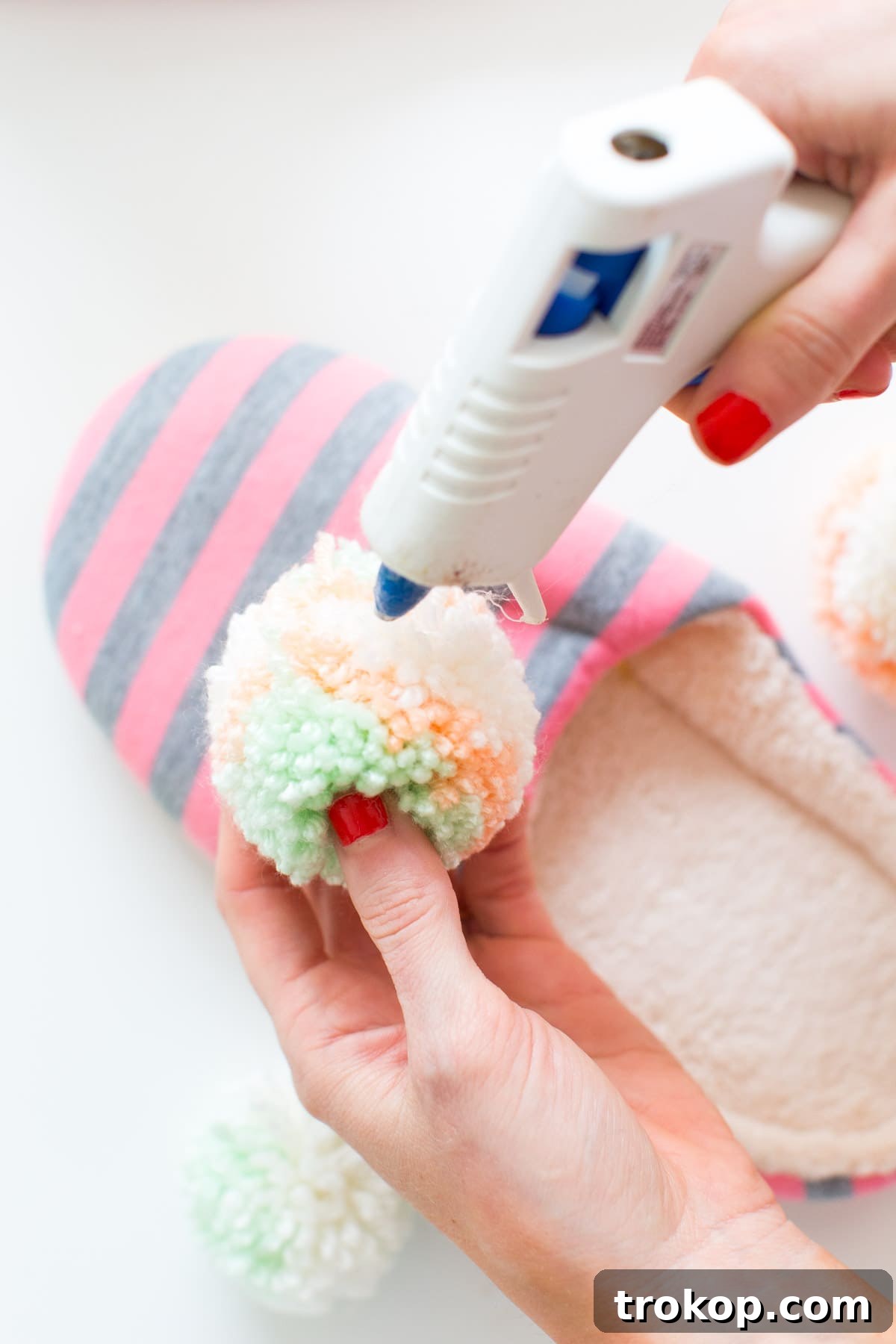 Learn to make personalized DIY pom pom slippers, a cozy winter project perfect for gifting or everyday comfort from Sugar & Cloth