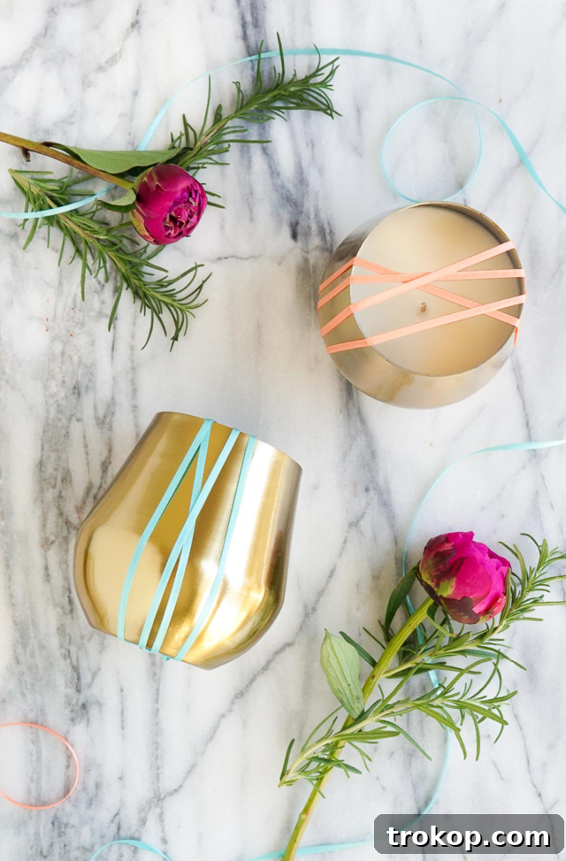 A collection of various homemade candles with essential oils, showcasing different styles and scents.