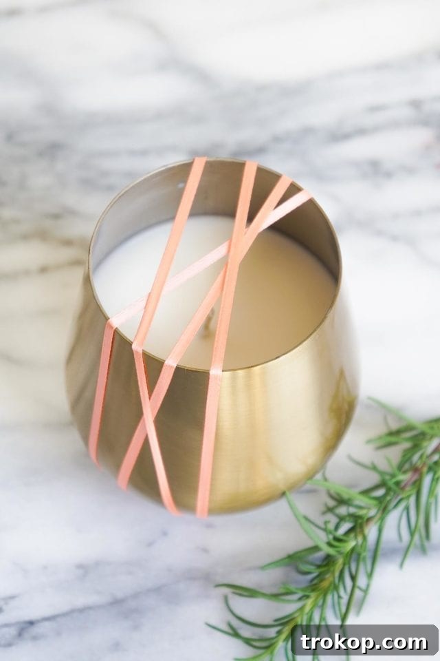 Close-up of a DIY Rosemary and Grapefruit Candle, ready to be burned.