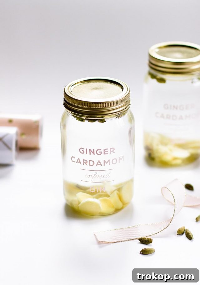 Close-up of a beautifully bottled ginger cardamom infused gin, highlighting the elegant presentation for a holiday gift. Recipe by Sugar & Cloth.