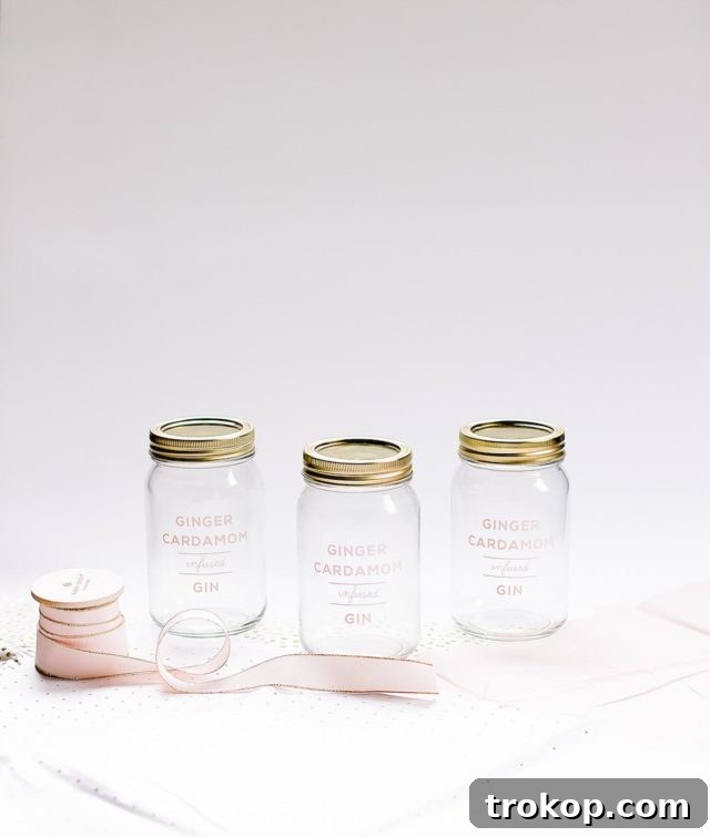 Ingredients laid out for making ginger cardamom infused gin: fresh ginger, cardamom pods, and a bottle of gin. This simple 3-ingredient recipe is a perfect DIY project.