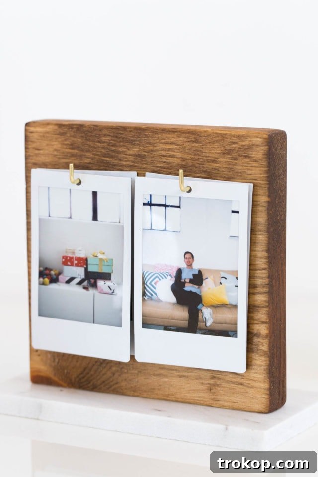 Craft Your Own Flip Photo Book 10 A DIY Flip Photo Album displaying Instax photos, styled on a minimalist desktop.