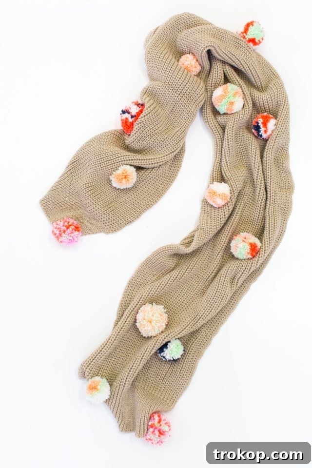 Crafting a unique and cozy DIY Statement Pom Pom Scarf, perfect for winter fashion.
