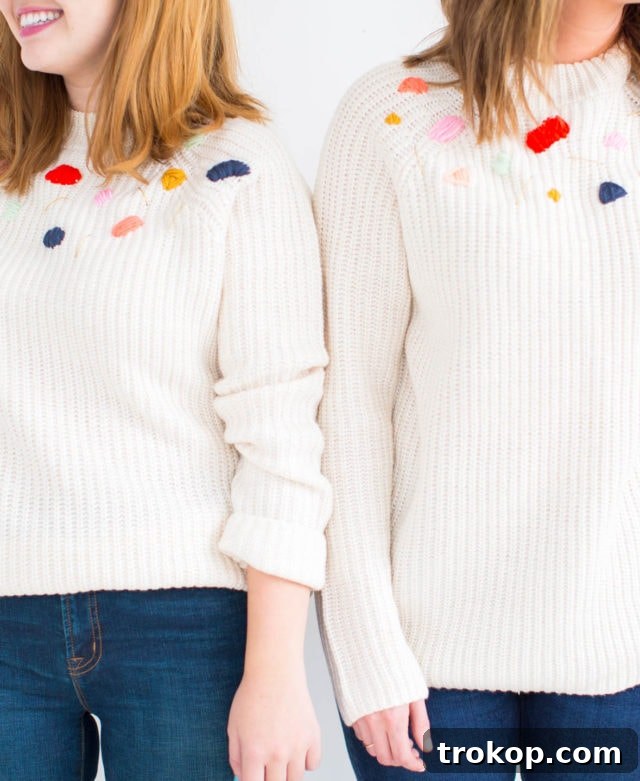 Custom Abstract Embroidery Pullover 10 An artistic flat lay of various yarn colors and textures, laid out creatively, inspiring potential abstract embroidery designs for a DIY sweater project.