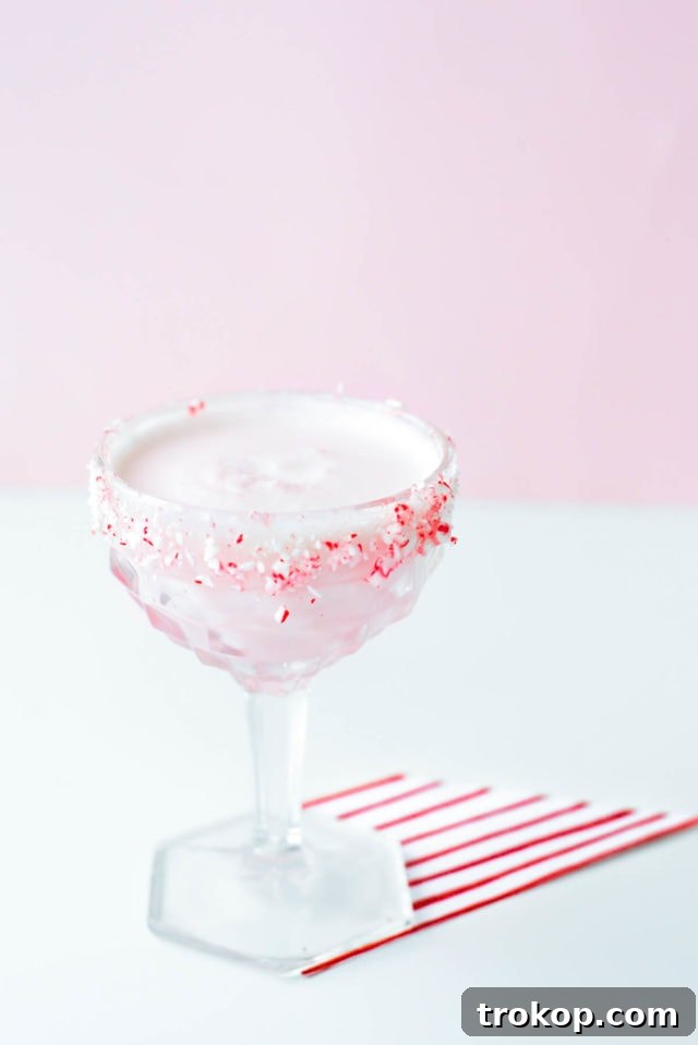 White Chocolate Candy Cane Cocktail recipe by Sugar & Cloth, an award winning DIY, recipe, and lifestyle blog.
