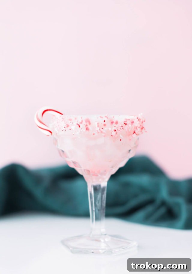 White Chocolate Candy Cane Cocktail recipe by Sugar & Cloth, an award winning DIY, recipe, and lifestyle blog.