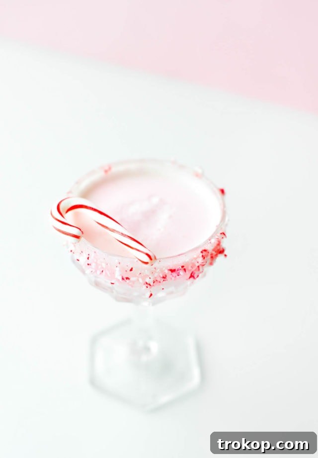 White Chocolate Candy Cane Cocktail recipe by Sugar & Cloth, an award winning DIY, recipe, and lifestyle blog.
