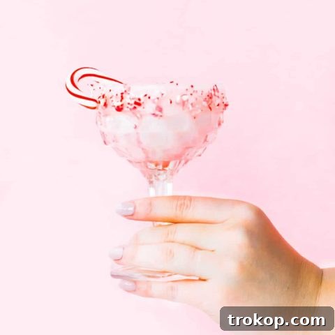 White Chocolate Candy Cane Cocktail recipe by Sugar & Cloth, an award winning DIY, recipe, and lifestyle blog.