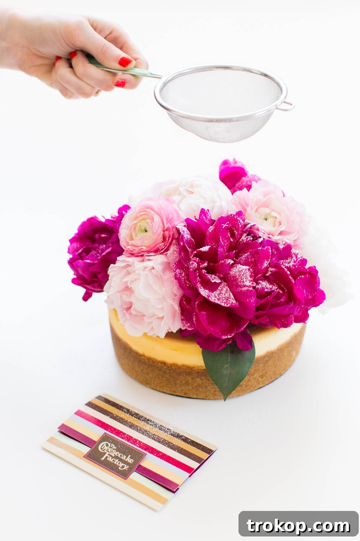 Elevate Your Cheesecake: Creative Topping Ideas 5 Close-up of a cheesecake with a beautiful, snow-dusted flower arrangement