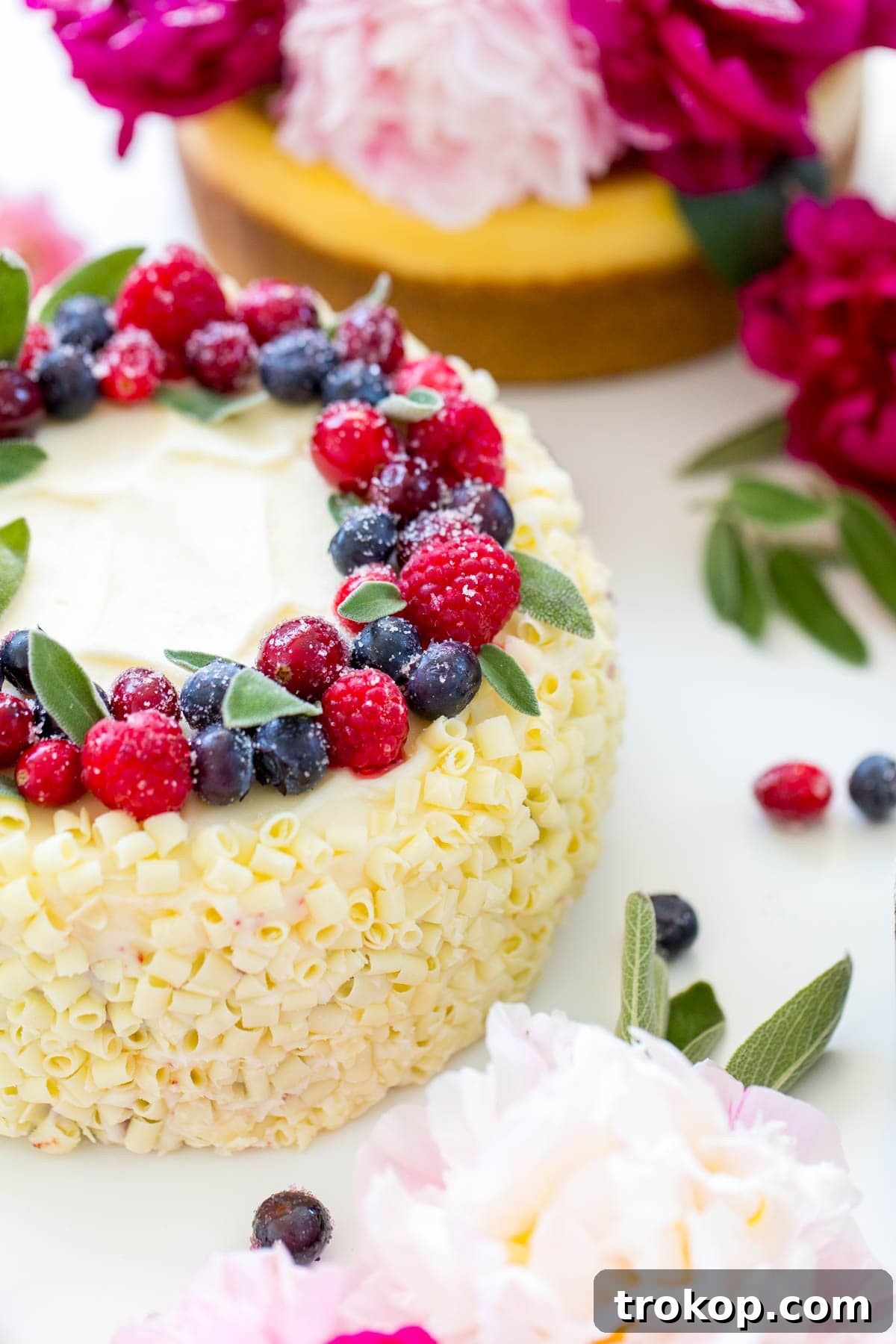 Elevate Your Cheesecake: Creative Topping Ideas 7 Beautifully decorated cheesecake with a festive berry and sage wreath topper