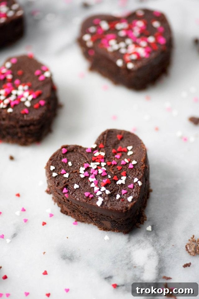 Close-up of a perfect frosted heart-shaped brownie, ready for Valentine's.