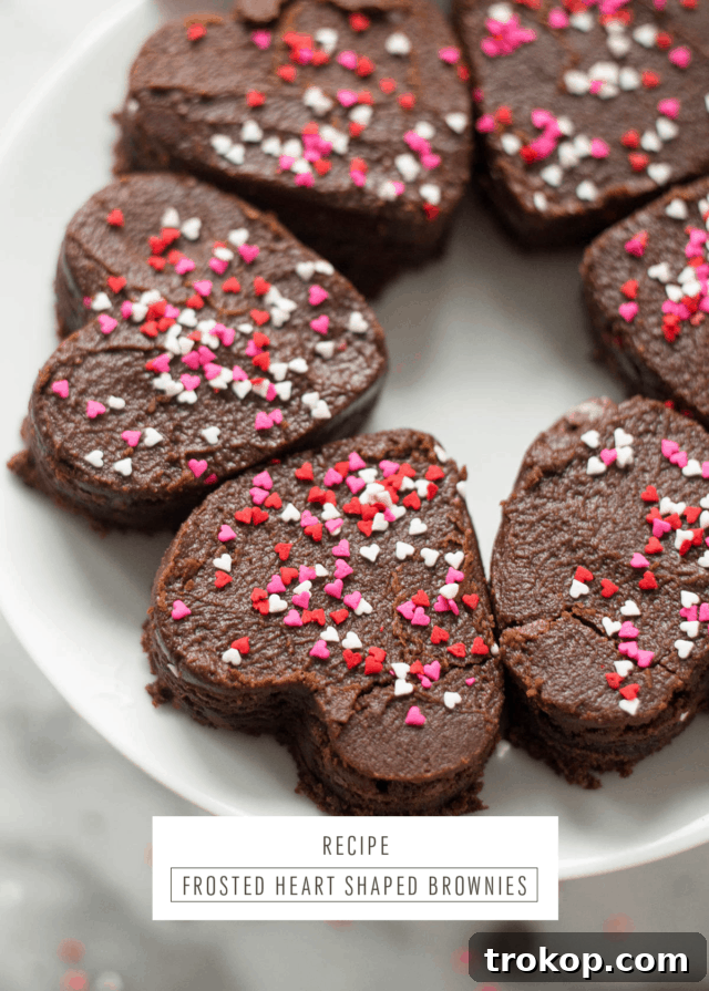 Variety of Valentine's Day desserts, including frosted brownies.