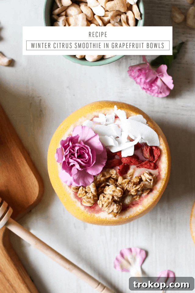 Final presentation of a Winter Citrus Smoothie in a grapefruit bowl, with custom text overlay from Sugar & Cloth, emphasizing healthy and delicious eating.