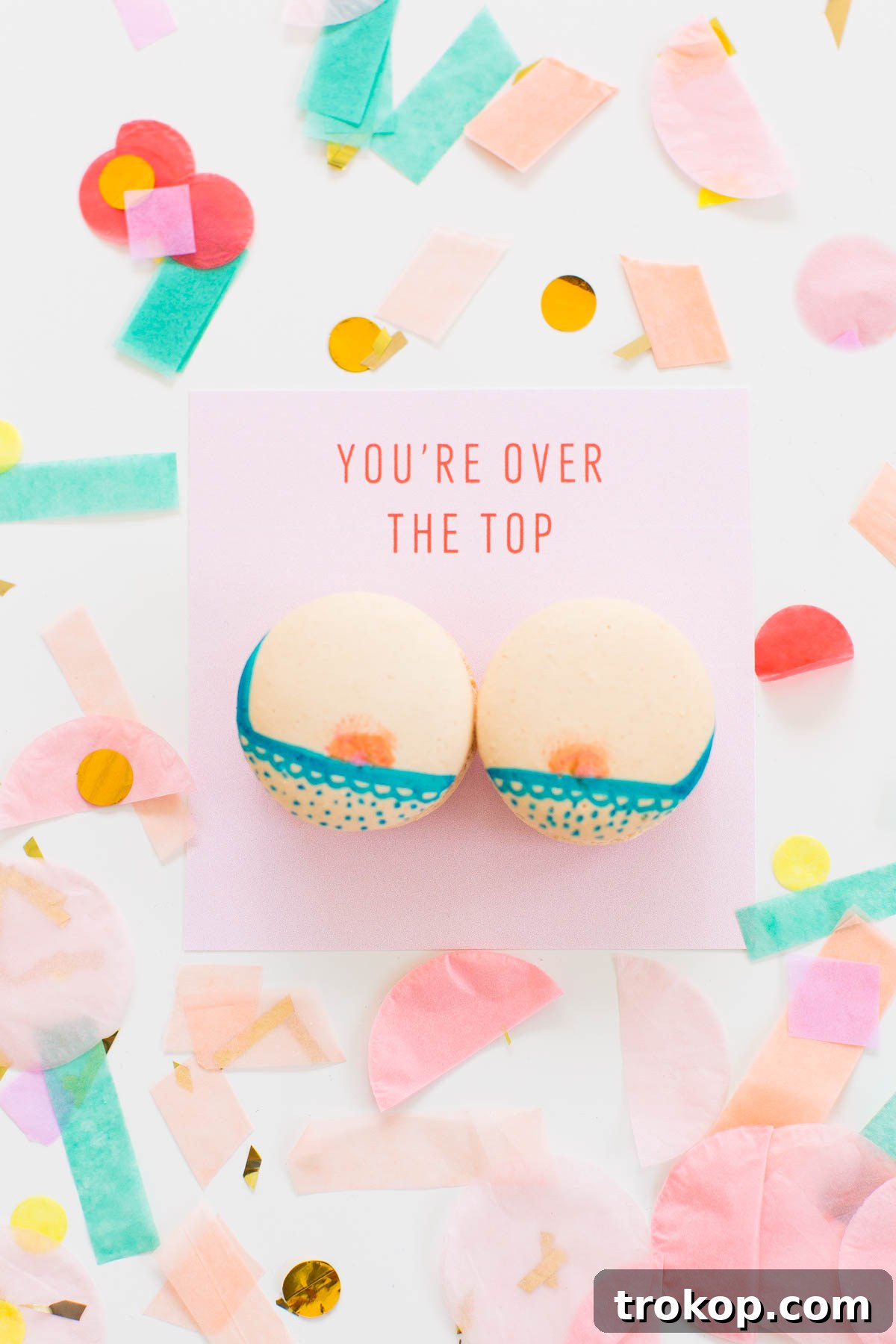 Close-up of a DIY Boob Macaron with a black bra design and pink nipple detail