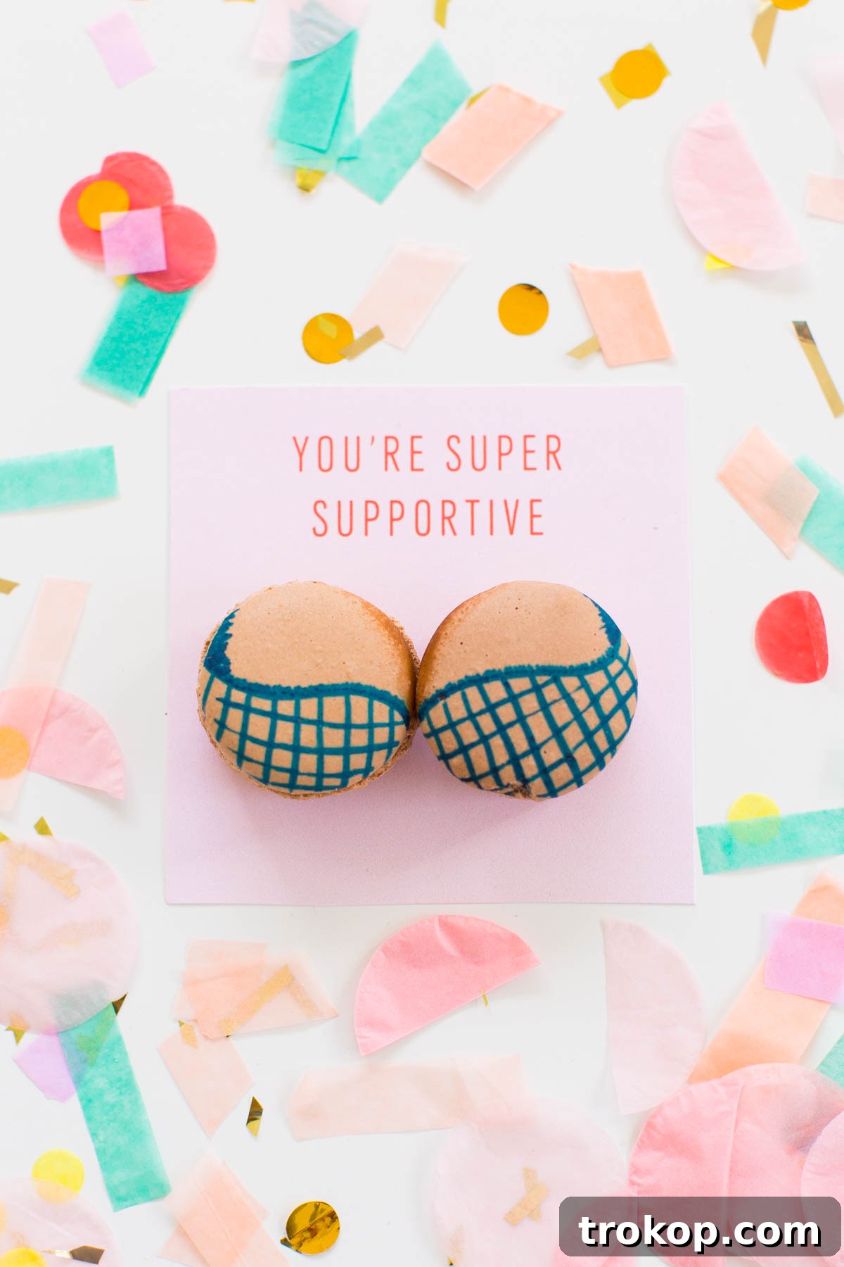 Another DIY Boob Macaron showcasing a red bra design on a vibrant pink macaron