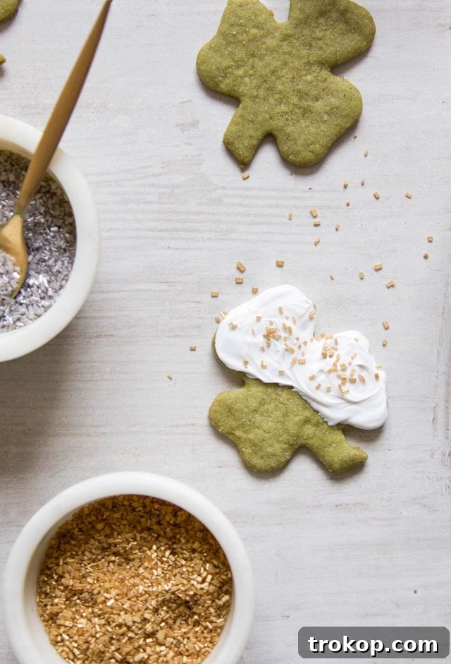 Assortment of White Chocolate Shamrock Matcha Cookies, some with sprinkles