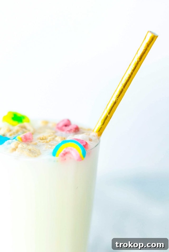 A festive Boozy Cereal Milk Egg Cream made with Lucky Charms, perfect for St. Patrick's Day celebrations or a unique cocktail hour.