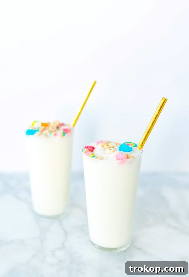 Close-up of a Boozy Cereal Milk Egg Cream, highlighting the cereal-infused milk base and festive topping.