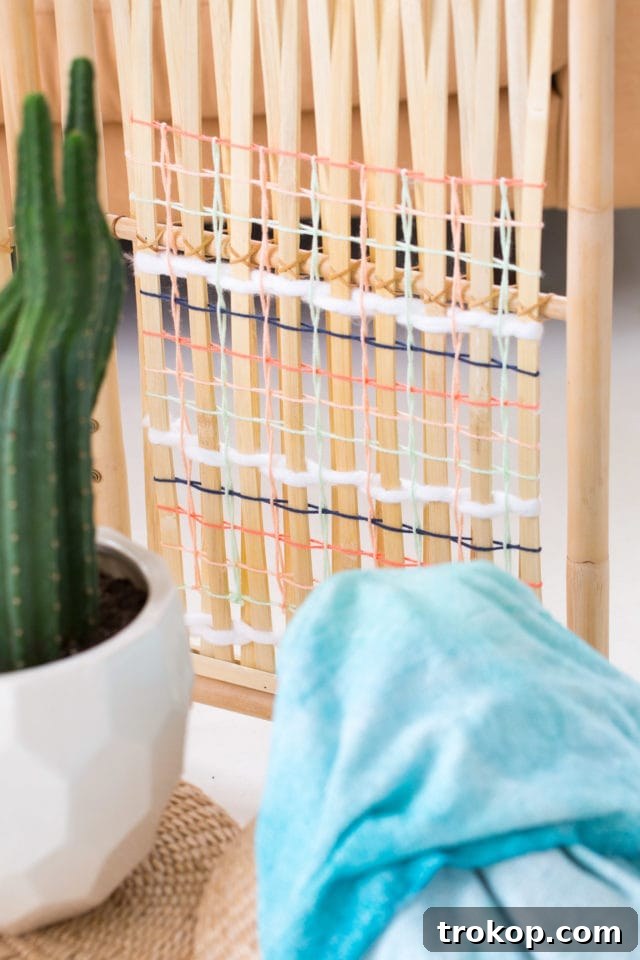 Weave Your Own Room Divider 3 Close-up of the beautiful DIY Ikea Hack Woven Room Divider by Sugar and Cloth, highlighting the intricate yarn details and natural rattan frame.
