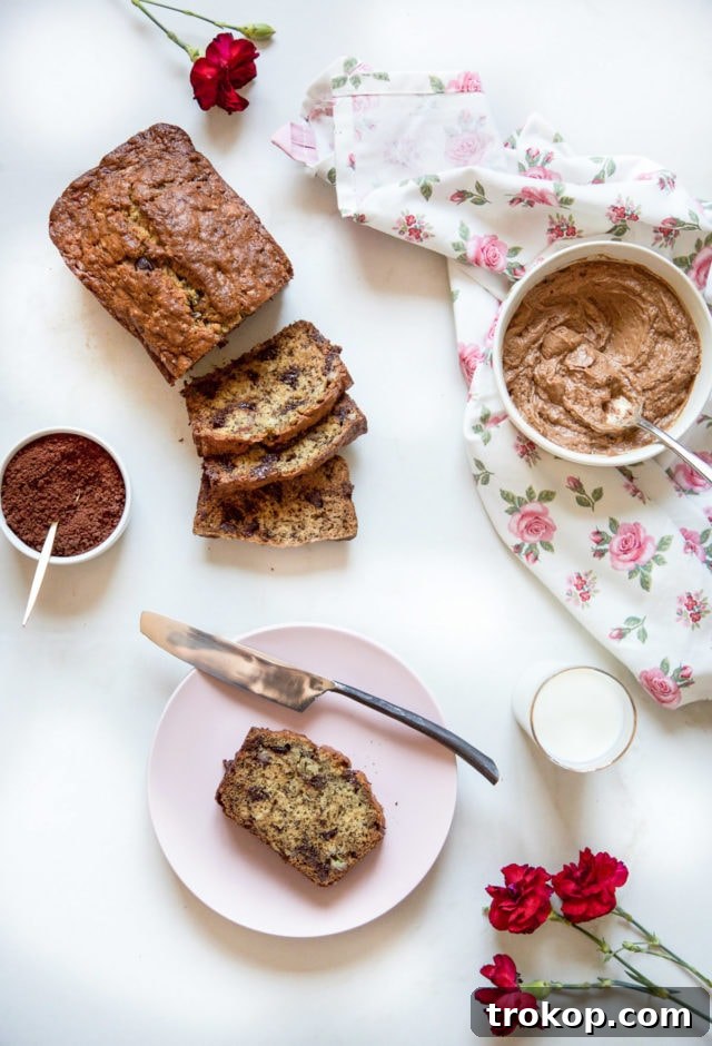Golden-brown, perfectly baked chocolate chip banana bread, still warm from the oven.