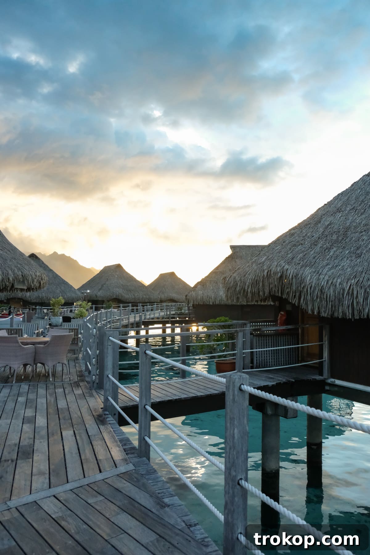 Sunset over the overwater bungalows in Moorea