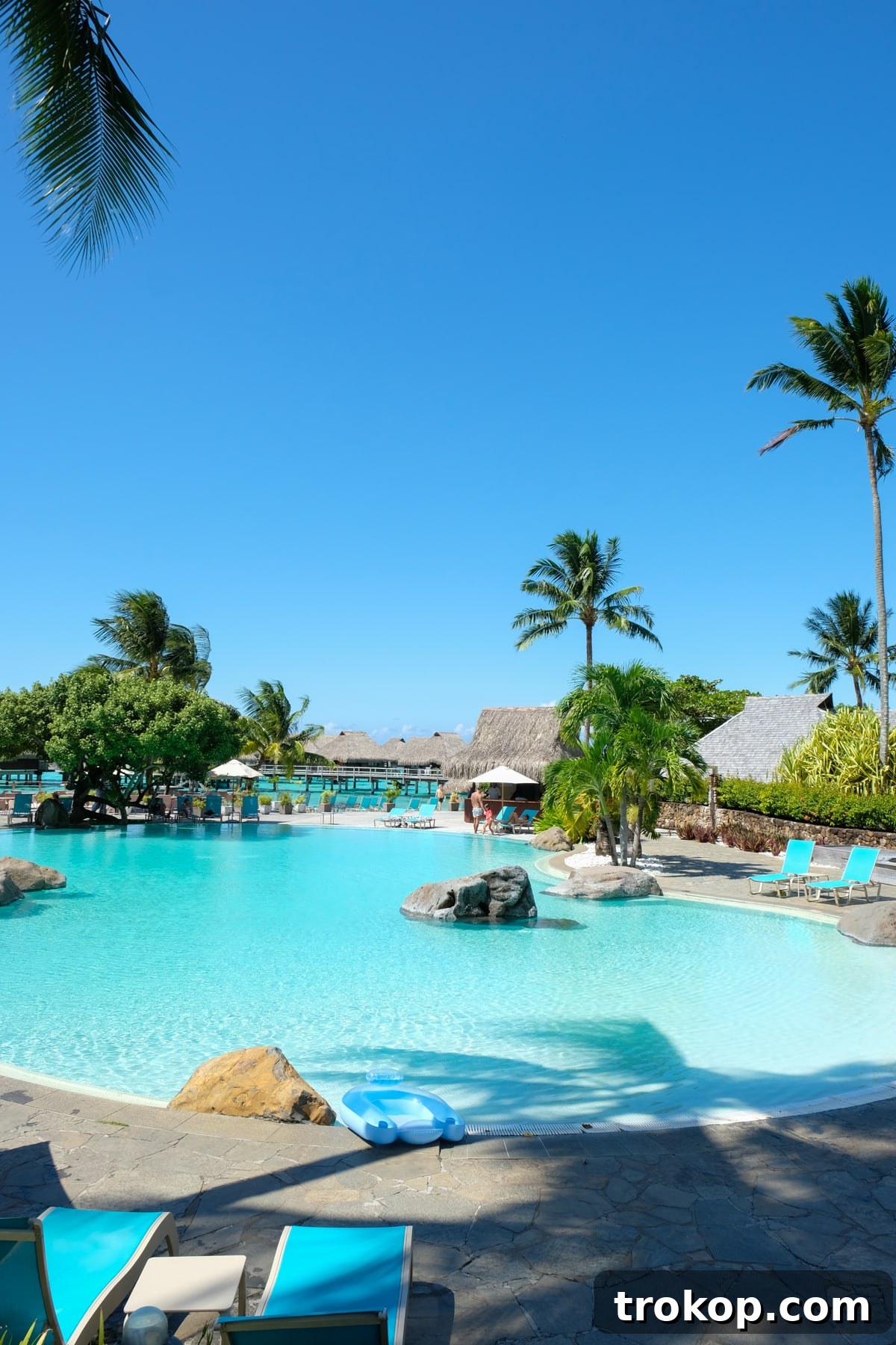 View of the crystal clear waters from an overwater bungalow in Moorea