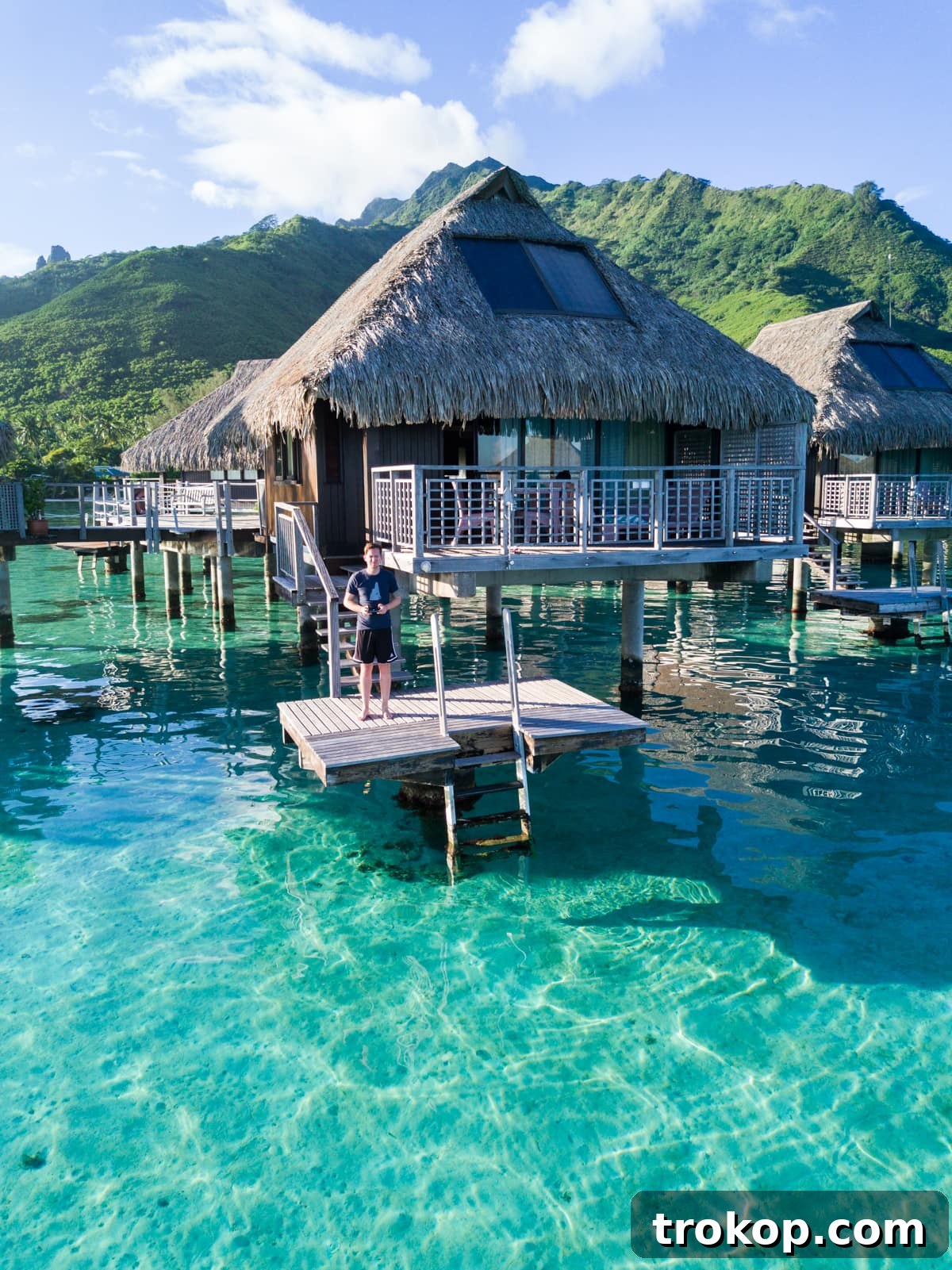 Honeymoon couple posing on a beach in Moorea, French Polynesia