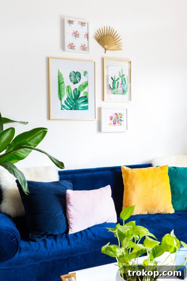 Vibrant watercolor cactus and floral prints adorning a modern wall, perfect for DIY home decor