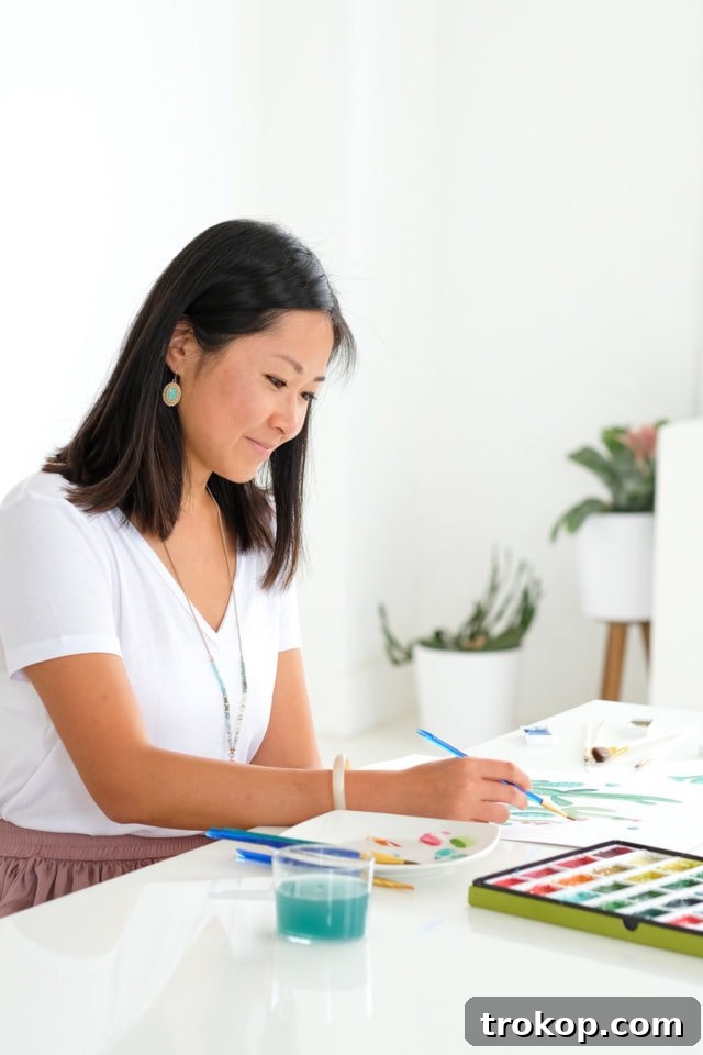 Artist Rong Rong Devoe painting watercolor fashion illustrations, inspiring the printable wall art