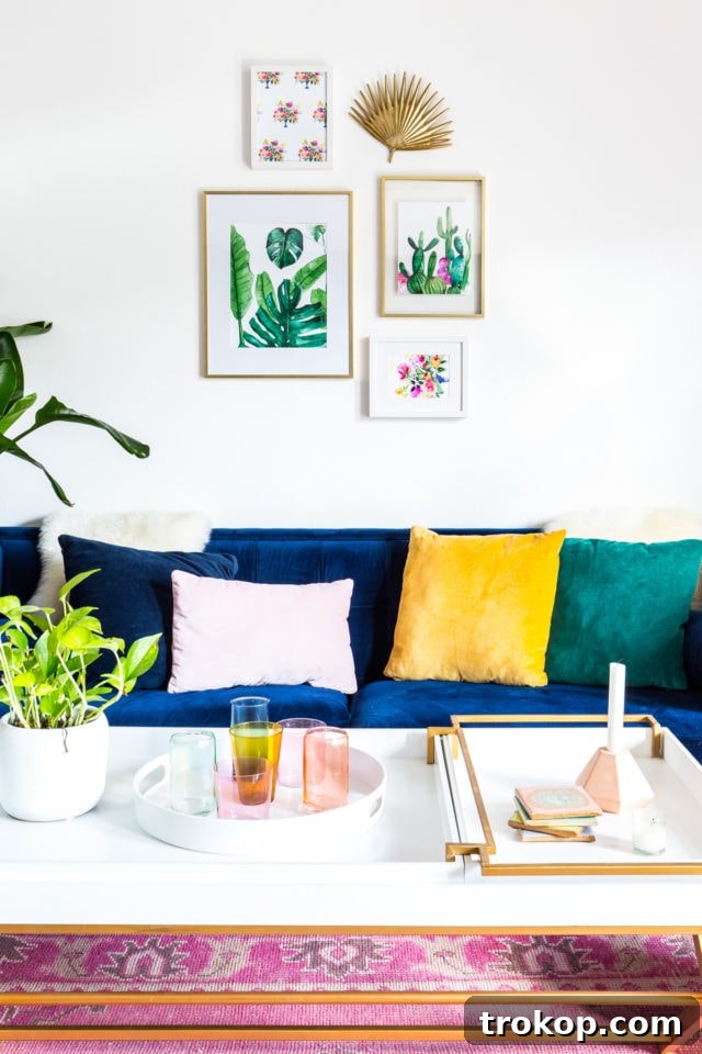 Botanical watercolor prints beautifully arranged above a couch, enhancing living room decor