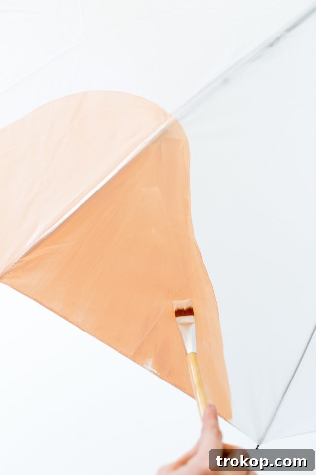 Detail shot of a hand-painted abstract umbrella, showing various colorful shapes and lines