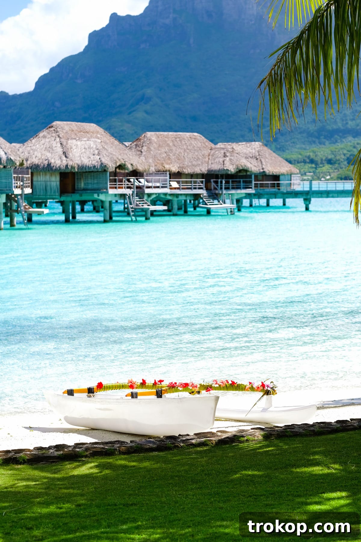 Relaxing by the calm, shallow waters near an overwater bungalow