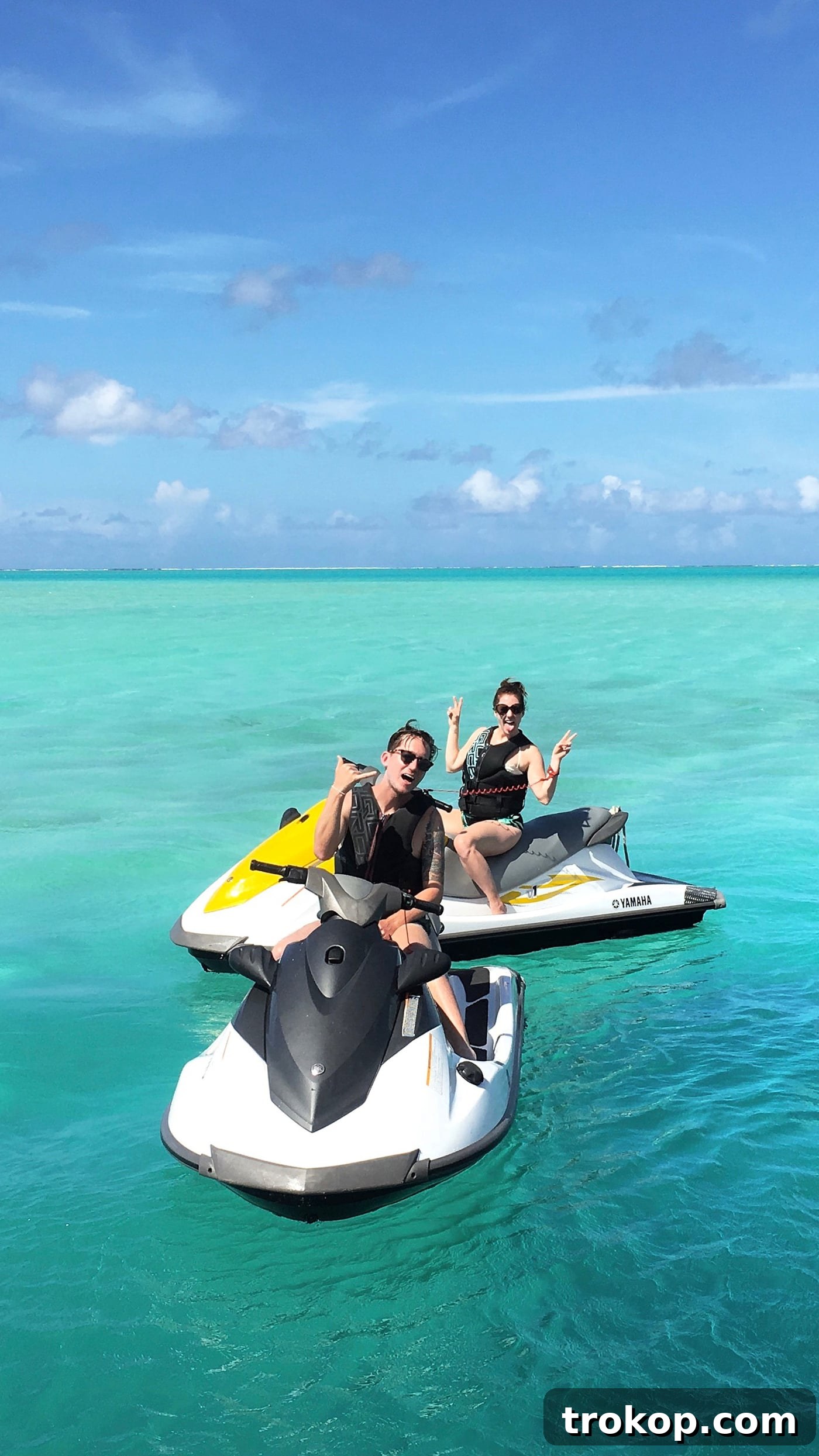 Couple enjoying a thrilling jet ski ride around Bora Bora island