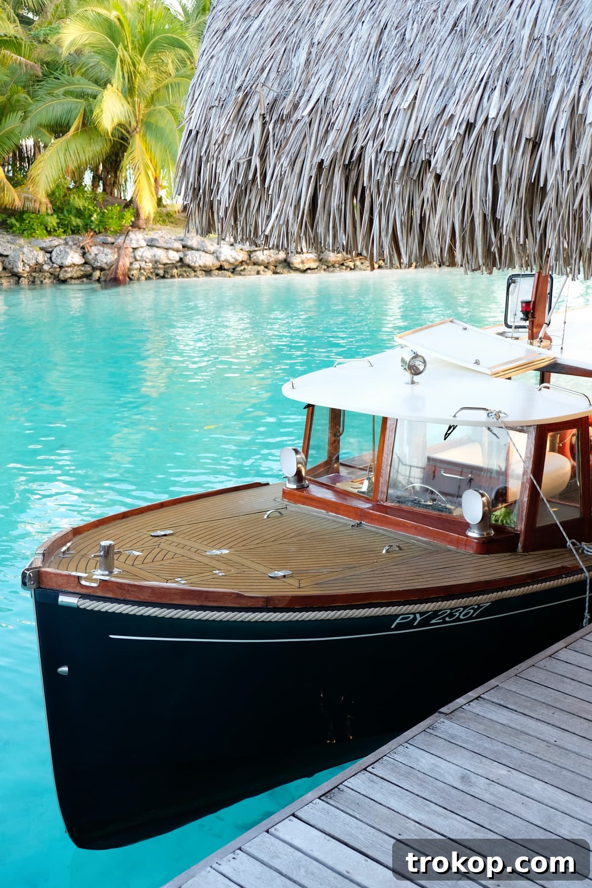 Couple relaxing on the private deck of their Four Seasons Bora Bora villa