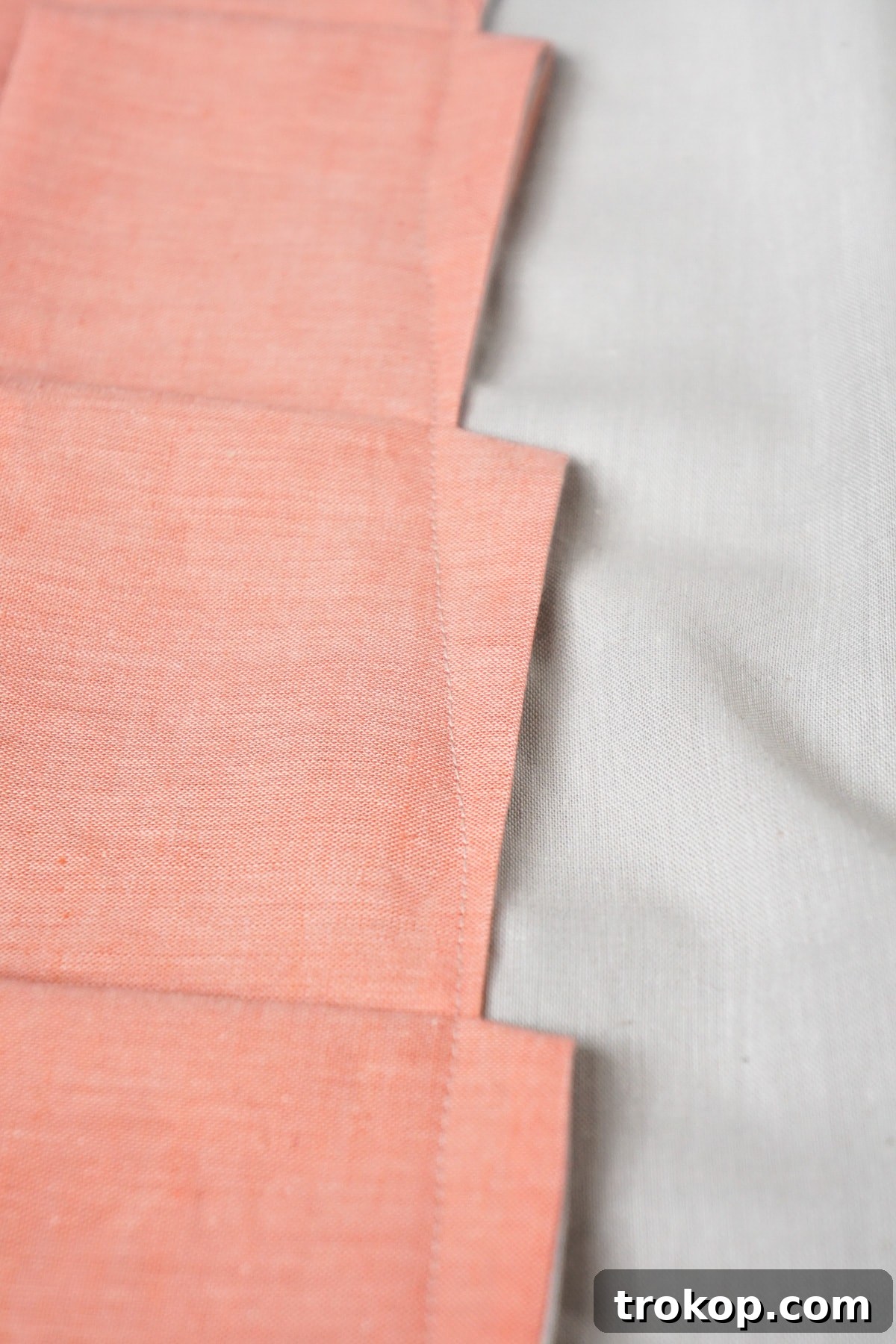 DIY Tailored Pleat Lumbar Cushion 12 Adding more pleated ribbons to create the design.