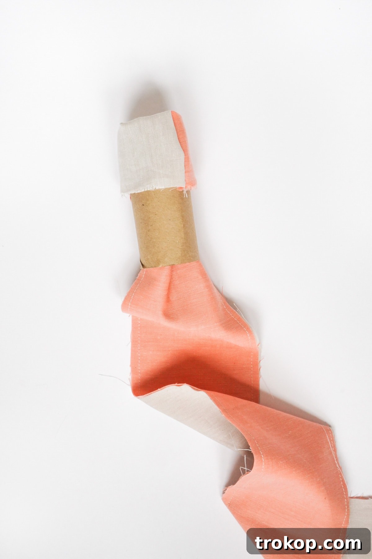 DIY Tailored Pleat Lumbar Cushion 8 Turning and ironing fabric strips into ribbons.