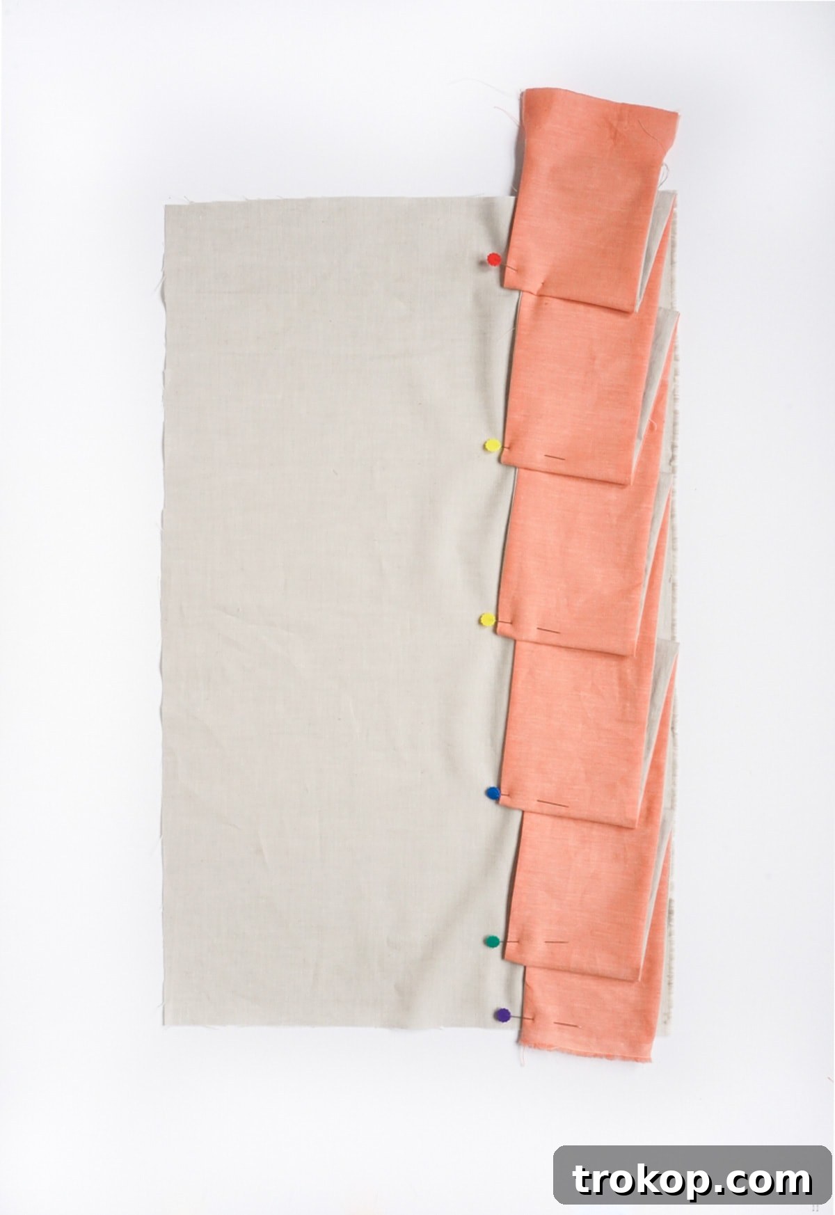 DIY Tailored Pleat Lumbar Cushion 10 Pinning fabric ribbons in zigzag pattern for pleats.