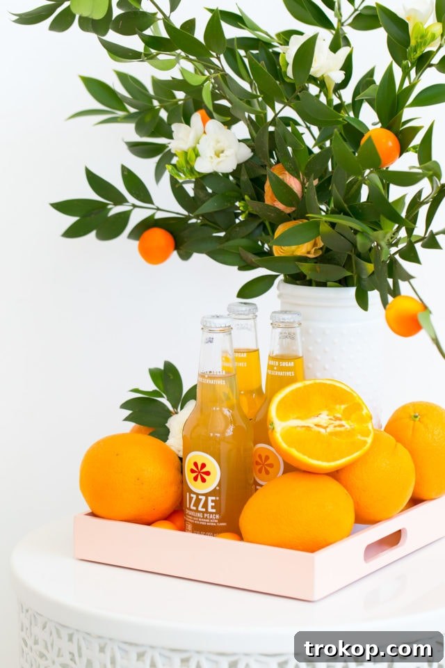 Close-up of orange-themed party food and drinks