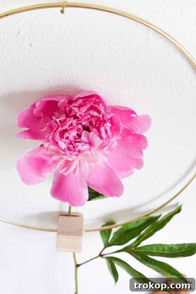 DIY Minimalist Flower Wall Hang: Final look, a single beautiful flower in a gold hoop